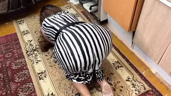 On the floor, a housewife is on her knees and feels a schlong in her booty when she has anal sex