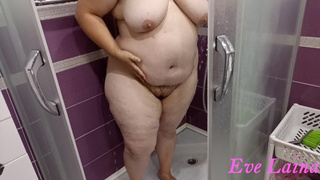 Older, curvy milf with a large, cellulite behind and massive titties takes a shower.